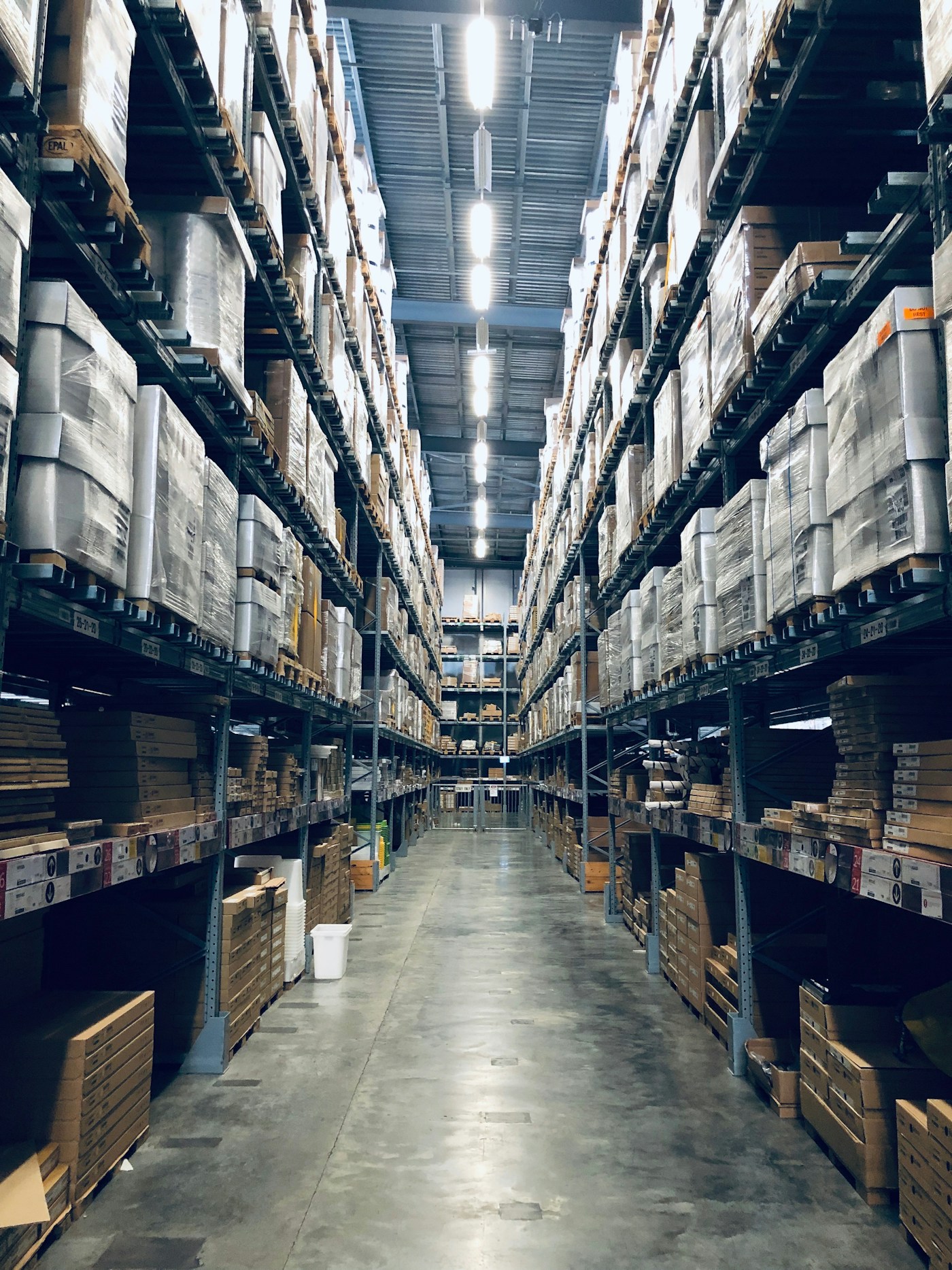 Organized warehouse with tall inventory shelving